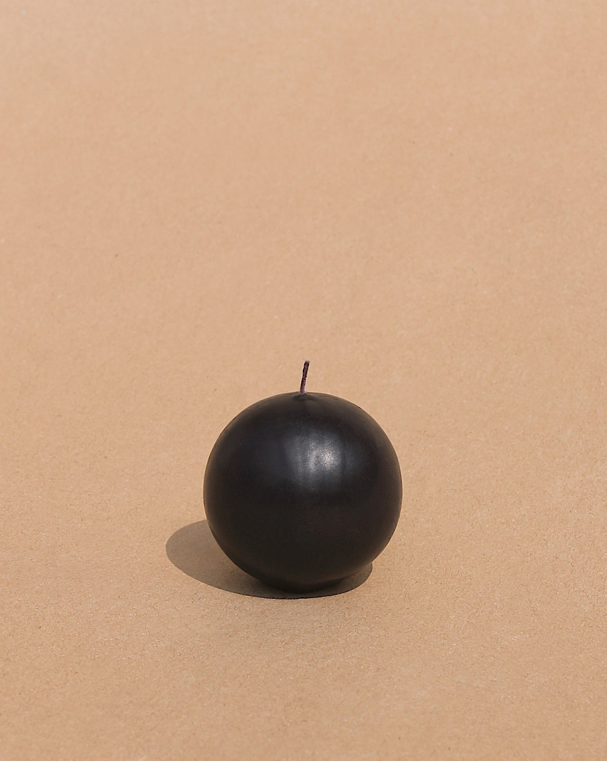 Round matte black candle