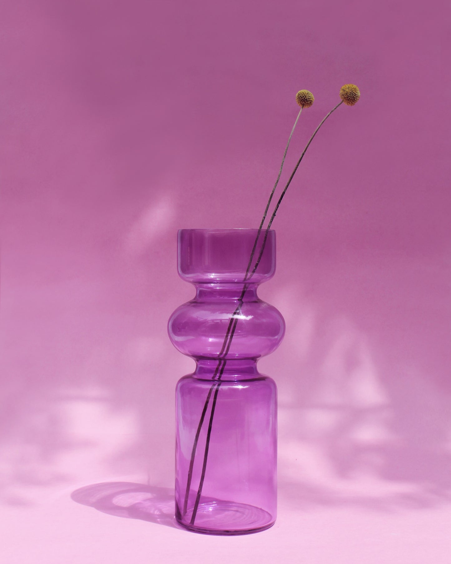 Modern glass vase with yellow flowers