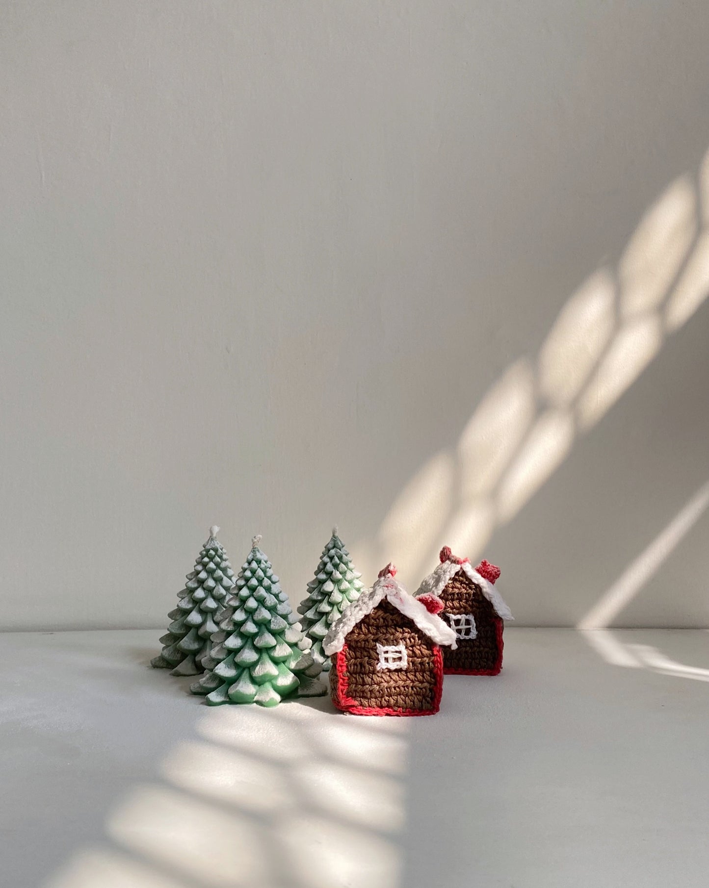 Christmas tree candles and crochet hut