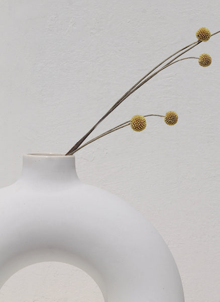 Half donut vase zoomed in version with dry florals