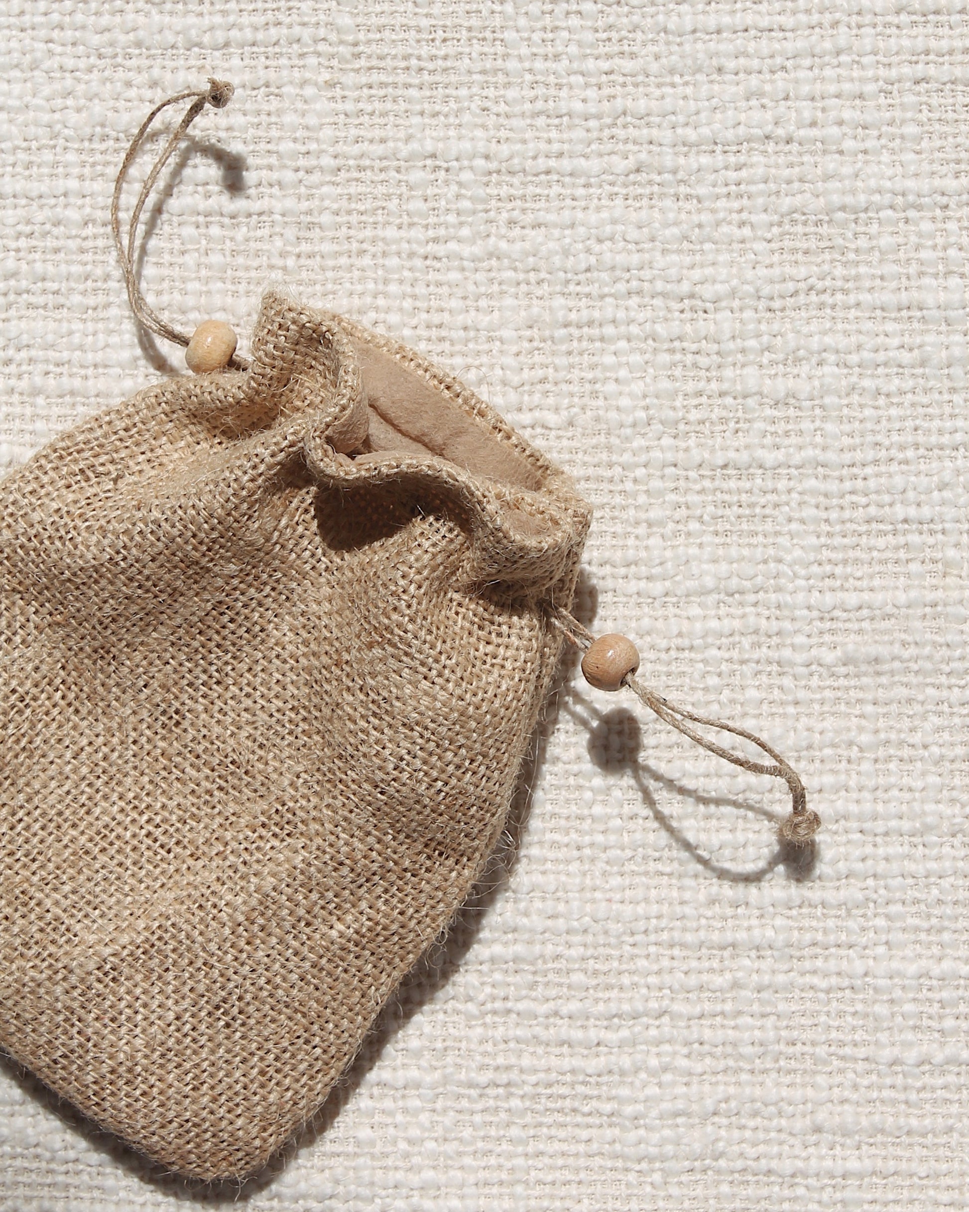 Natural Jute bag with wooden beads on the strings