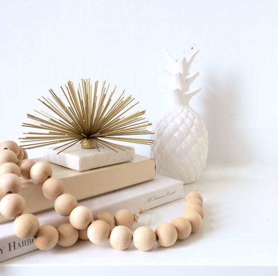Wooden beads on a pile of books